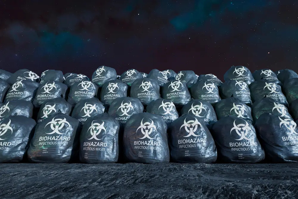 a large pile of black bags with white text