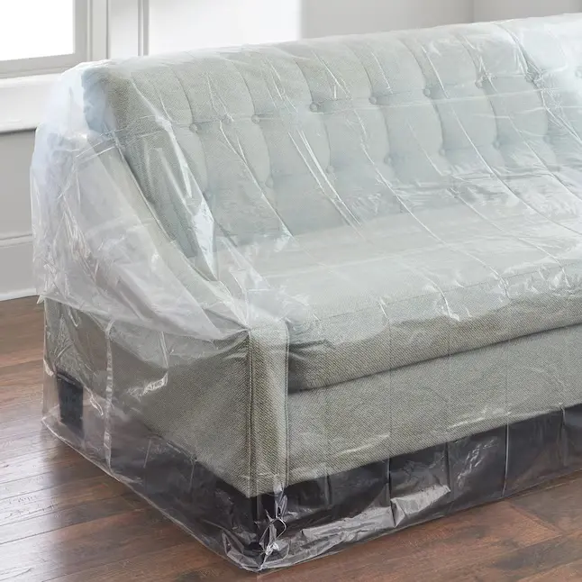 a couch covered in plastic