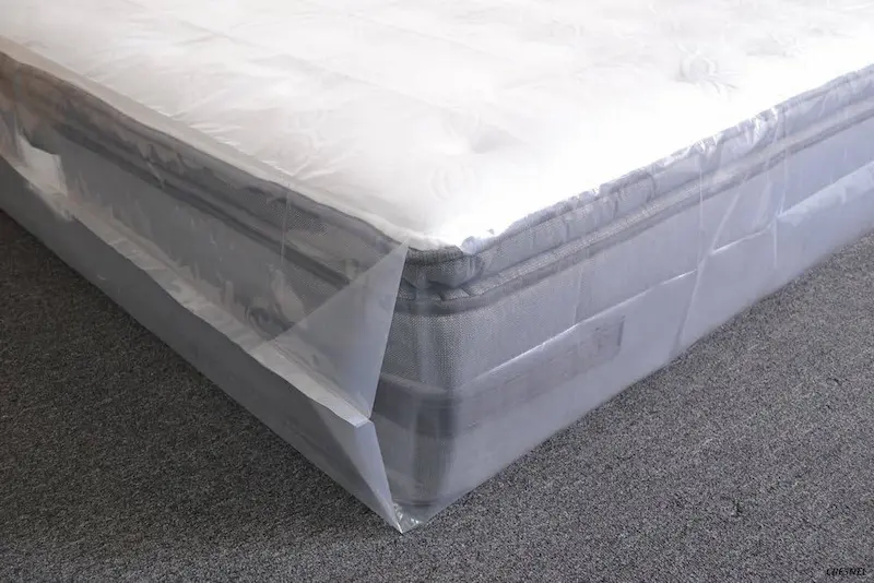 a mattress wrapped in plastic