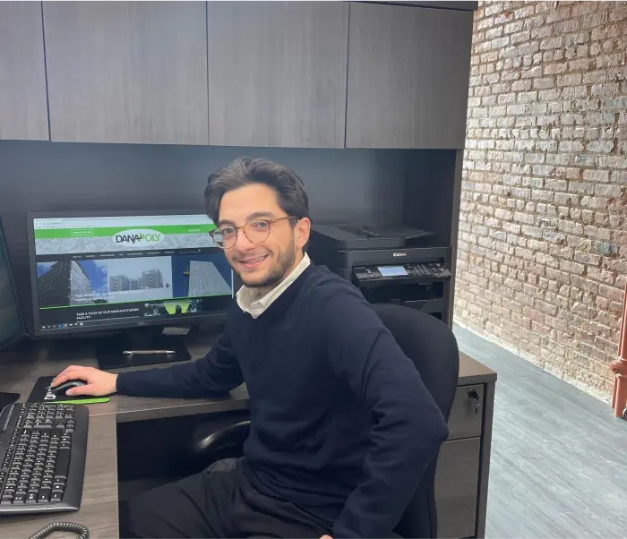a man sitting at a desk with a computer