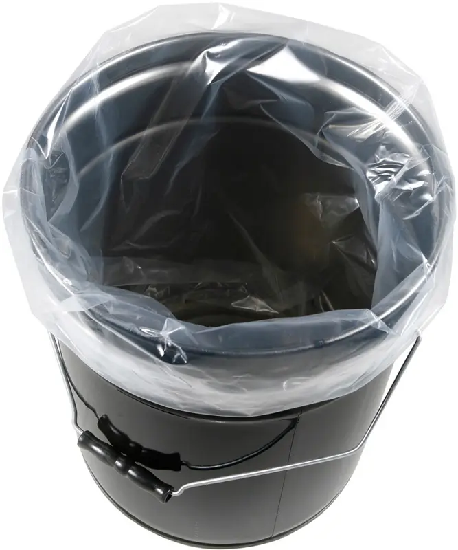 a black bucket with a plastic bag on it