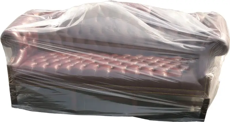 a couch covered in plastic