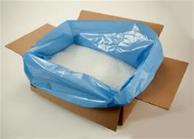 a blue bag in a cardboard box
