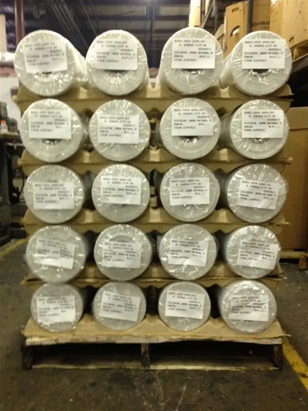 a pallet of rolls of paper