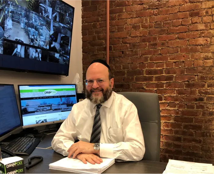 a man sitting at a desk with a computer