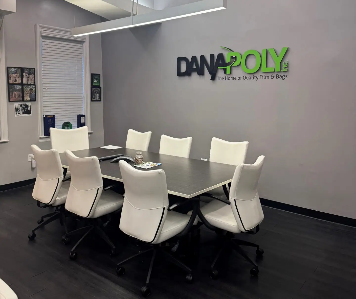 a conference room with a table and chairs