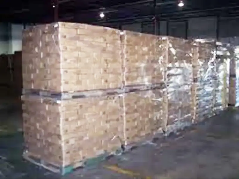 a large stack of boxes in a warehouse
