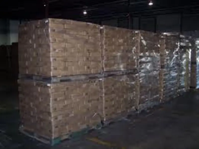 a large stack of cardboard boxes