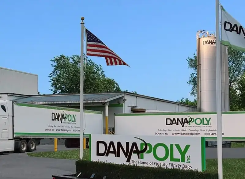 a flag flying in front of a building