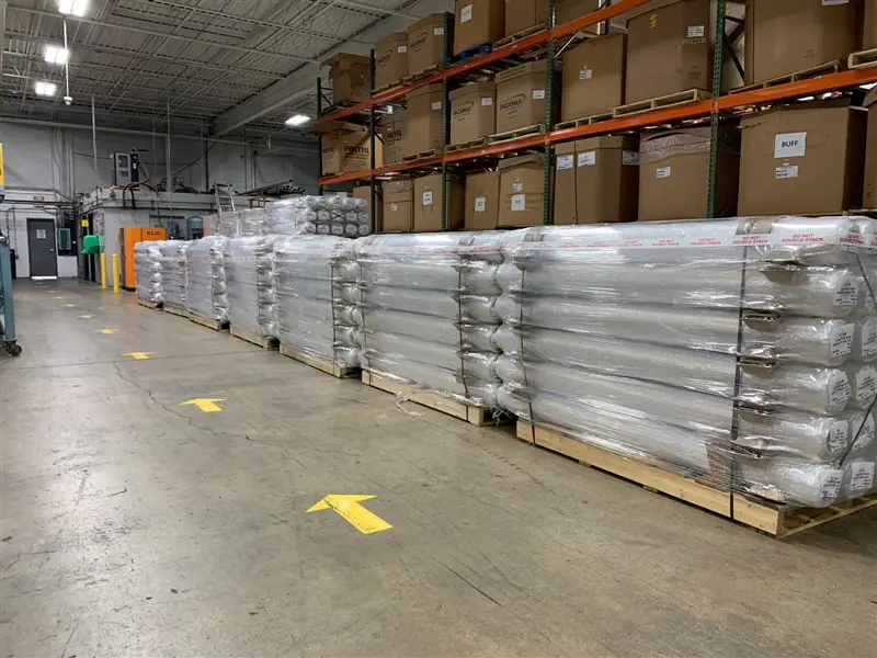 a warehouse with stacks of packages