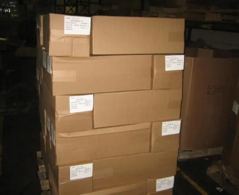 a large stack of cardboard boxes