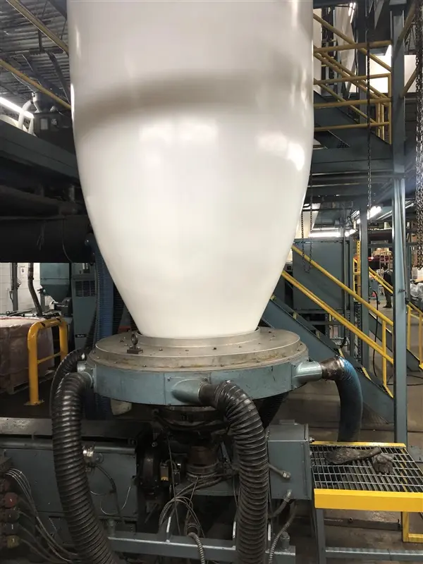 a large white container on a machine