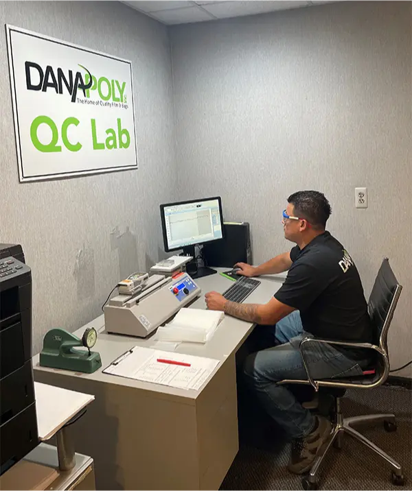 a man sitting at a desk with a computer