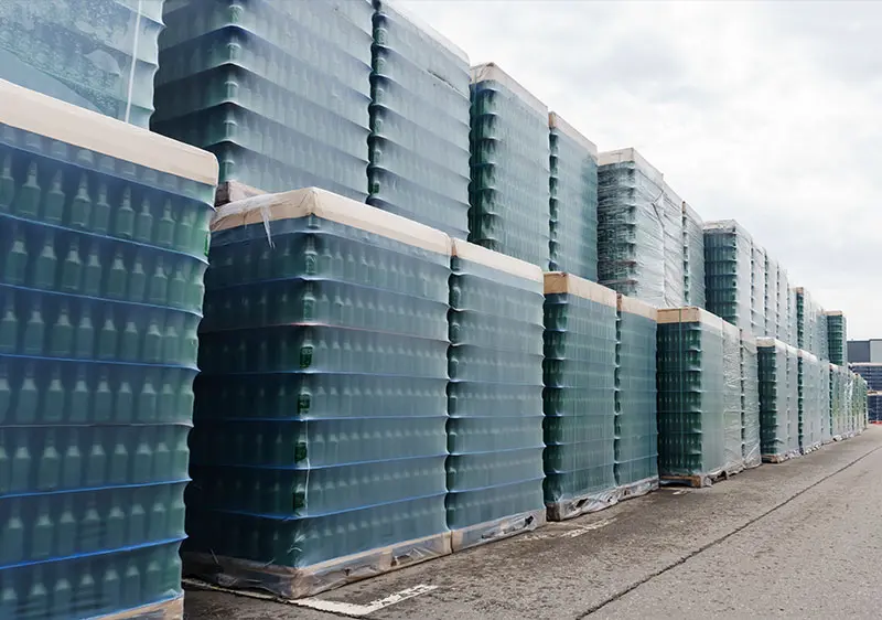 a large stack of bottles