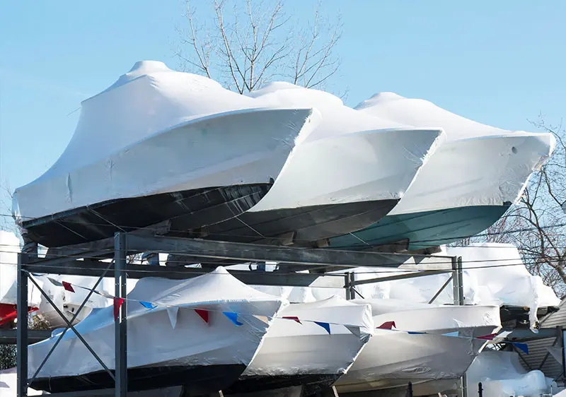 boats covered boats on a rack